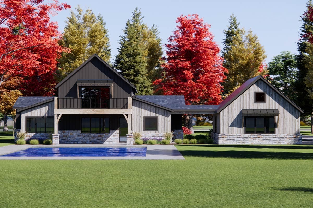 Modern Farmhouse house plan exterior with two stories, stone base, dark vertical siding, and a second-story balcony.