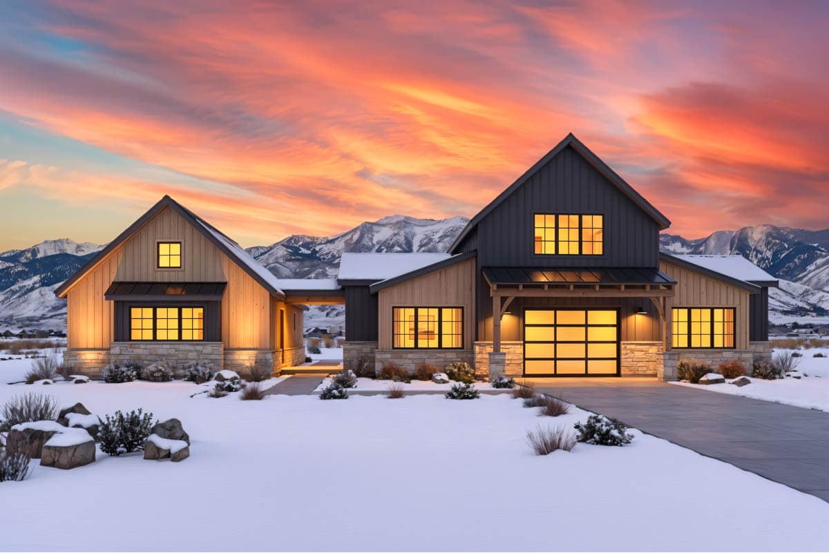 Modern Farmhouse house plan exterior with gabled roofs, stone accents, and attached garage with glass door.