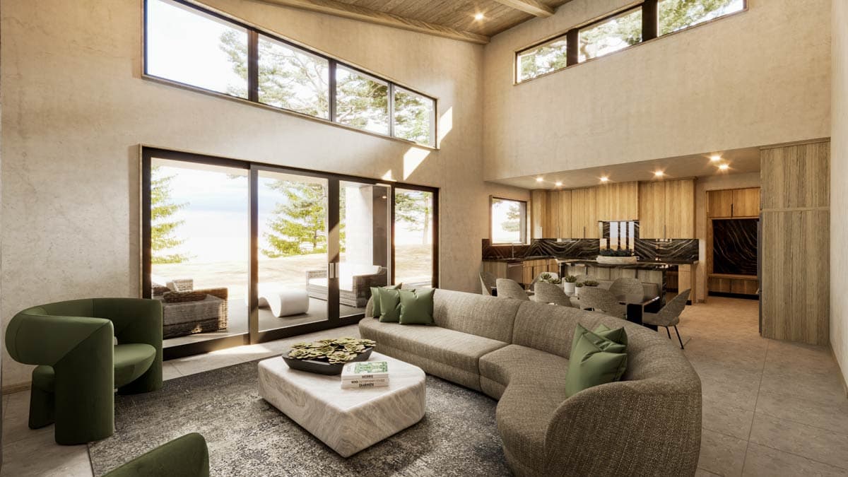 Modern living room with a large sofa, green chairs, and large windows overlooking a scenic view.