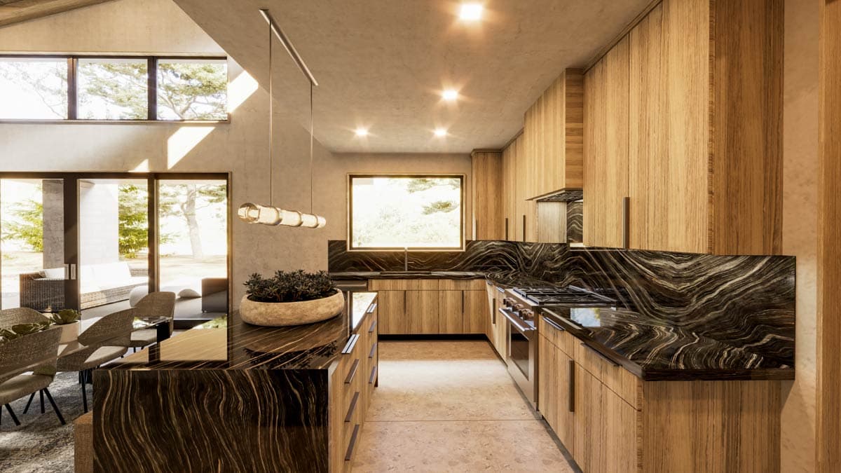 Modern kitchen with wood cabinets, dark granite countertops, and an island. Dining area visible, with natural light and views of the outdoors.