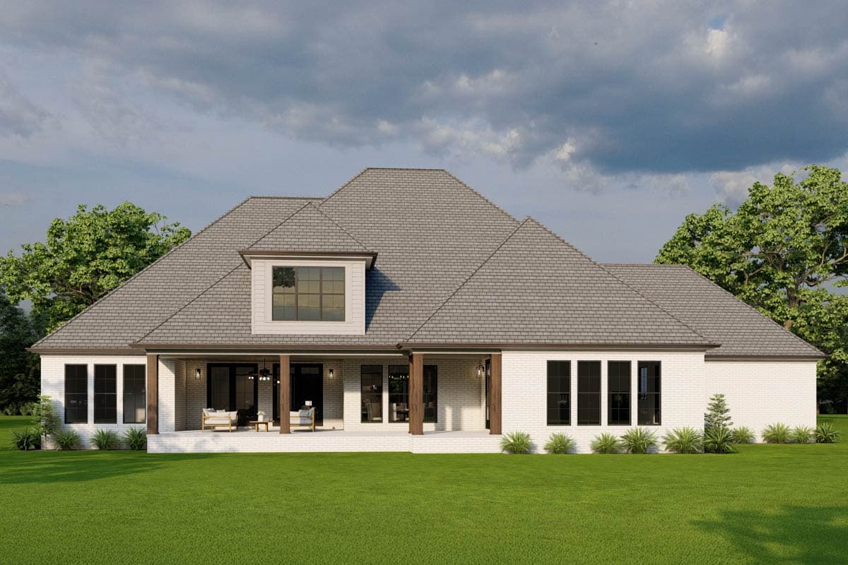 House plan exterior: Ranch style, single story, with a dormer, covered porch, and large windows.