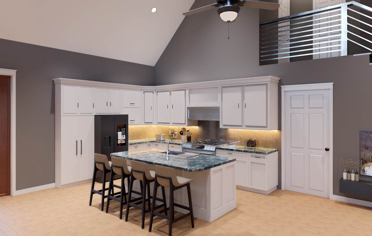 Kitchen with vaulted ceiling, large island with seating, white cabinets, and a view of a lofted railing.