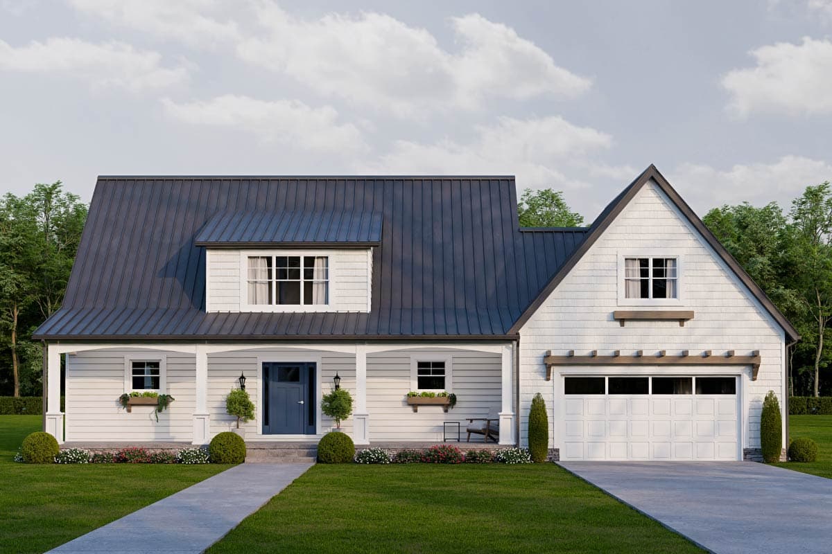 A white farmhouse with a dark gray metal roof, blue front door, and a two-car garage. A concrete path leads to the porch.