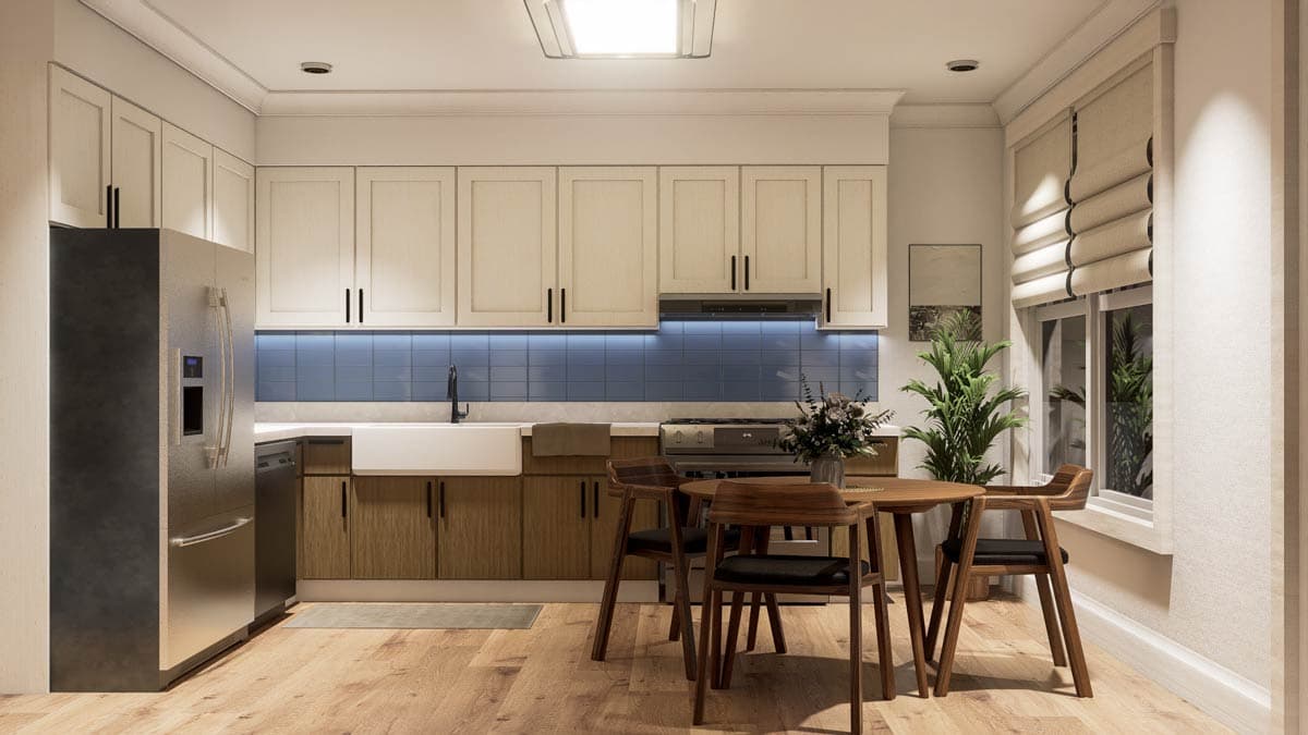 A modern kitchen with light-colored cabinets, blue tiled backsplash, and a wooden dining table with chairs. Natural light streams from the window.