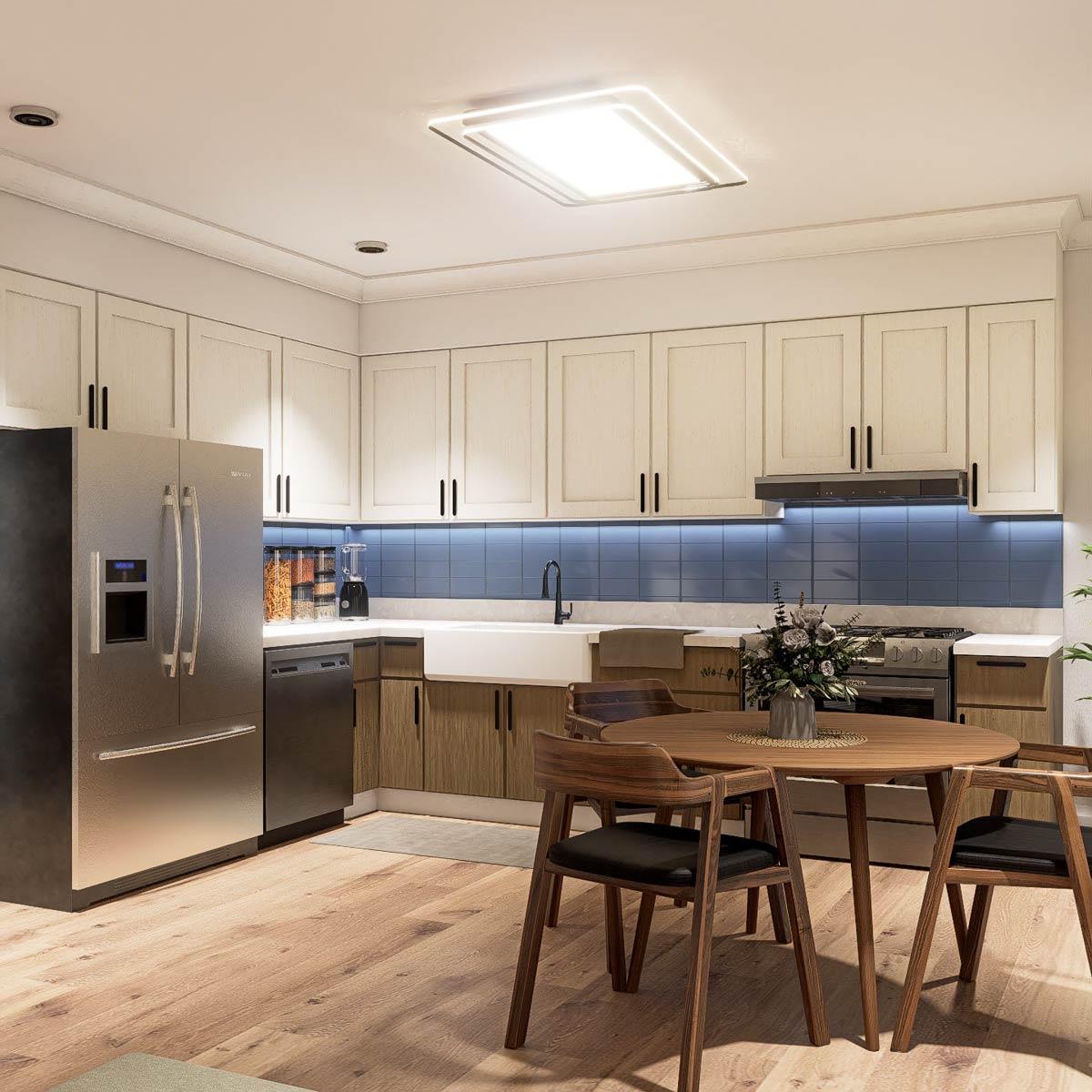 A modern kitchen with white cabinets, blue backsplash, and a round wooden table with chairs. Stainless steel appliances.