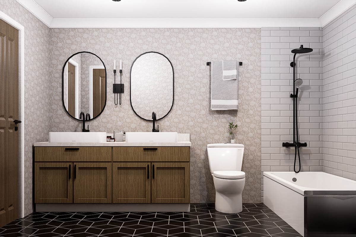 Modern bathroom with double vanity, oval mirrors, and a black and white tiled floor. Shower, toilet, and bathtub complete the space.