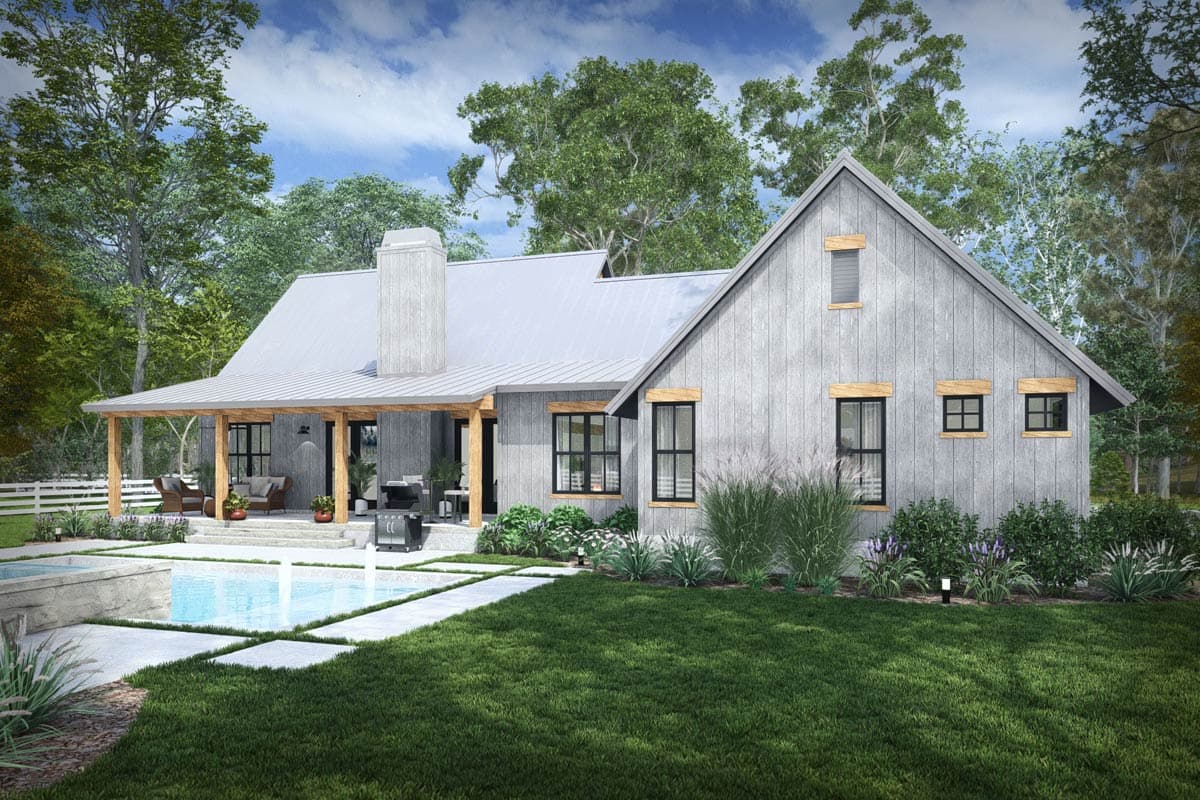 Modern Farmhouse house plan exterior with metal roof, large chimney, covered porch, and multiple gables.