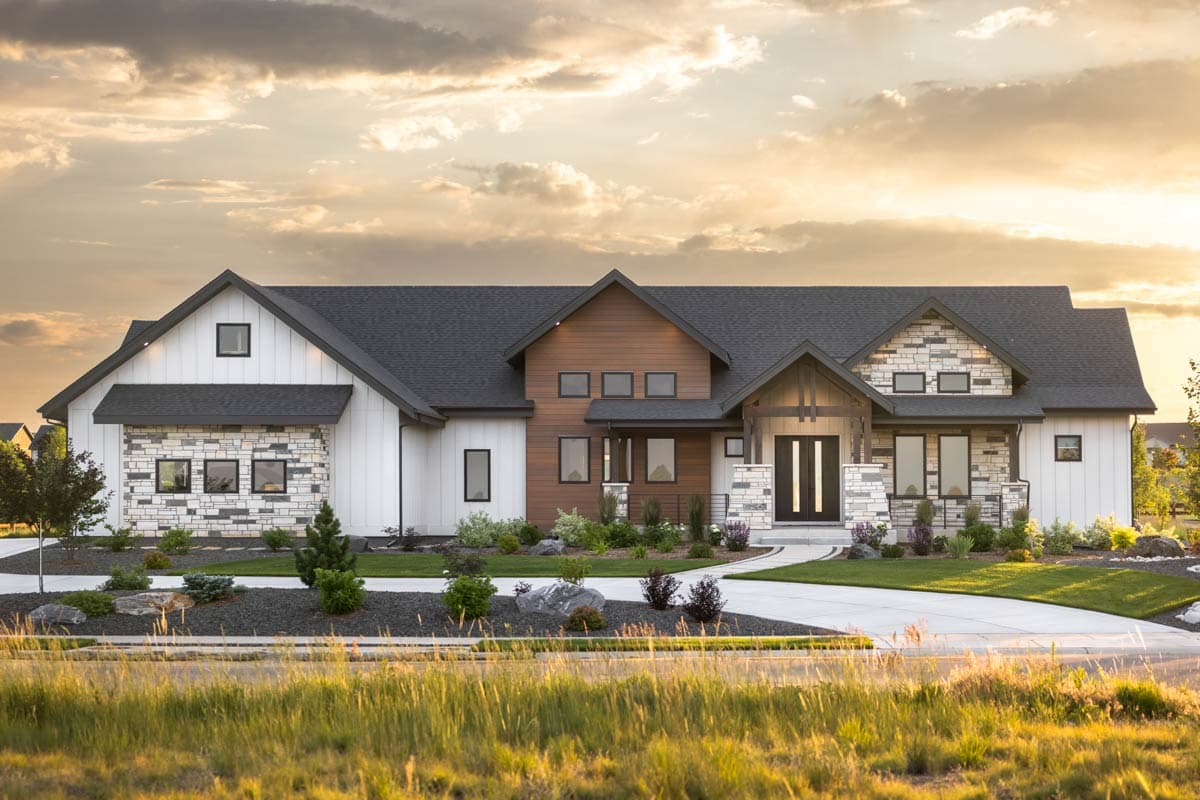 House plan exterior. Modern farmhouse style with gabled roof, stone accents, wood siding, and covered entry. Single-story construction.