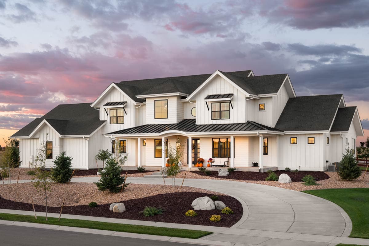House plan exterior featuring Modern Farmhouse style, two stories, covered porch, multiple gables, and dark rooflines.