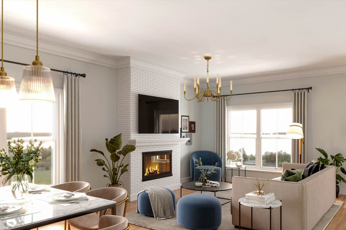 Interior view of a living and dining room with a brick fireplace, television, sofa, chairs, and dining table.