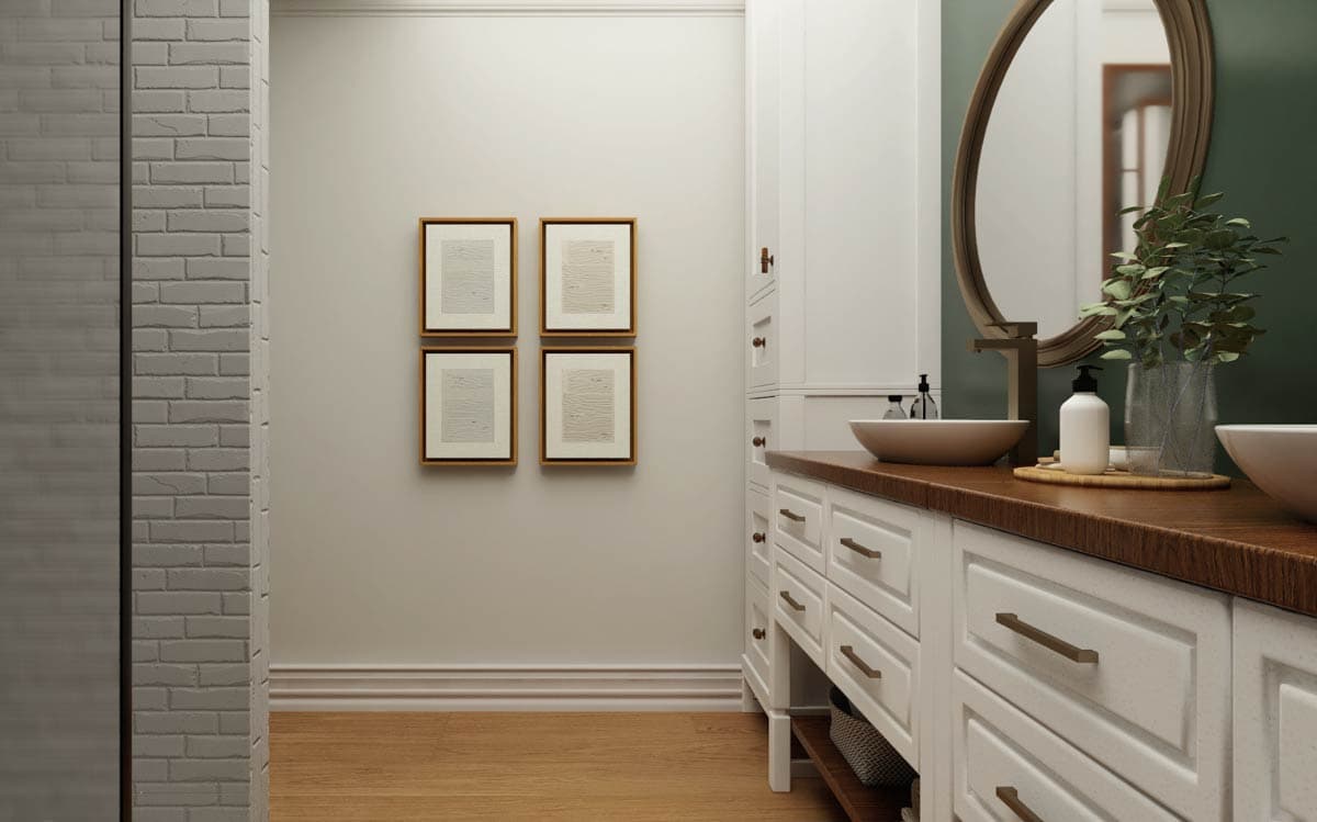 Modern bathroom with double vanity, inset drawers, wooden countertop, vessel sinks, oval mirror, and framed art.