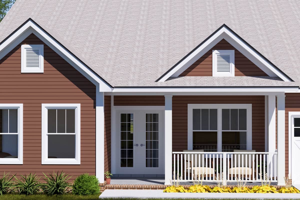 House plan exterior: Red siding, gables with vents, white-trimmed windows, and a covered porch with double doors.