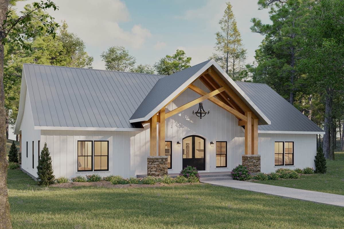 House plan exterior: Modern Farmhouse style, one story, with a metal roof, exposed beams, stone-clad pillars, and an arched entry.