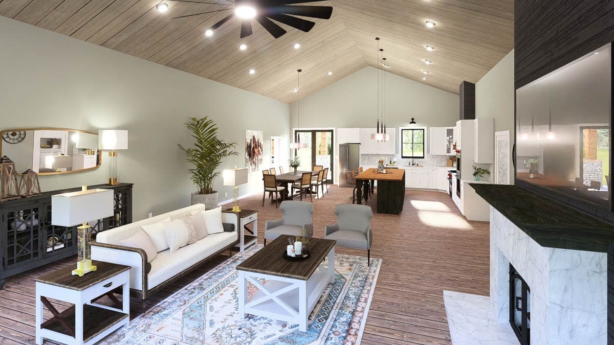Open-concept living area with vaulted wood-paneled ceiling, fireplace, kitchen island, and dining area.