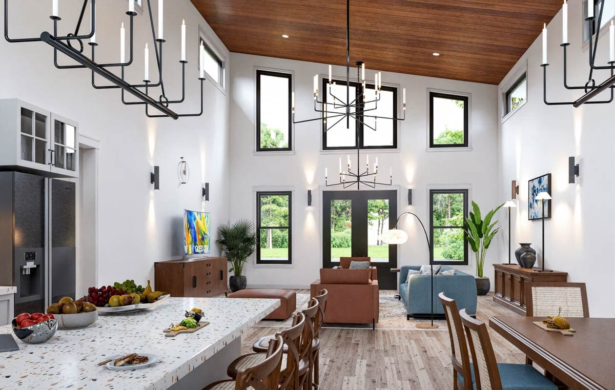 Open concept living area with vaulted wood ceiling, large windows, multiple chandeliers, and a kitchen island.
