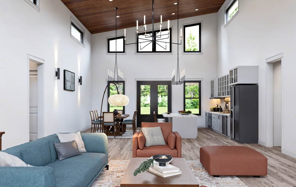 Open concept living area with vaulted wood ceiling, modern kitchen, dining area, and living room seating.