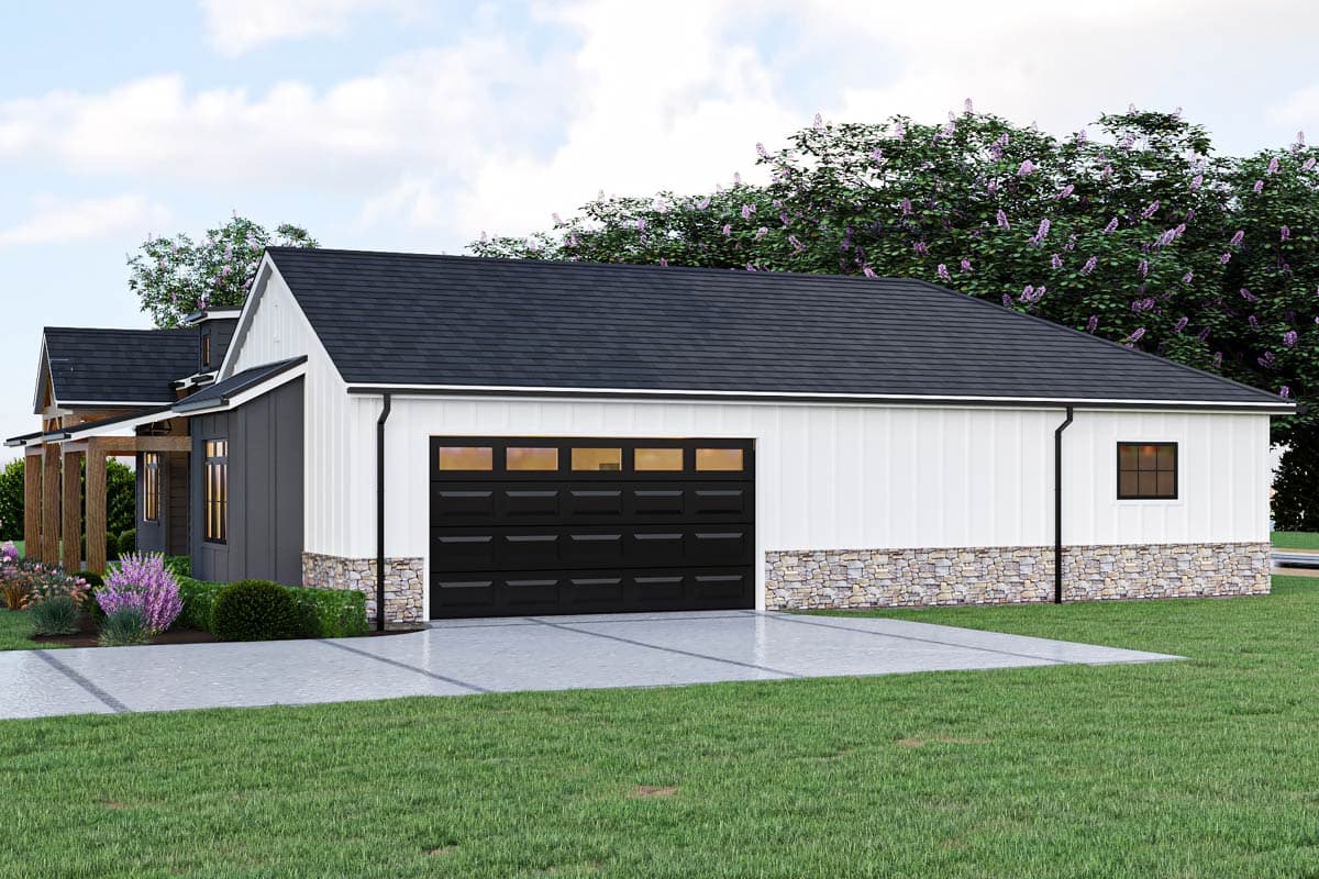 Modern Farmhouse house plan exterior with white board and batten siding, stone base, and a two-car garage.