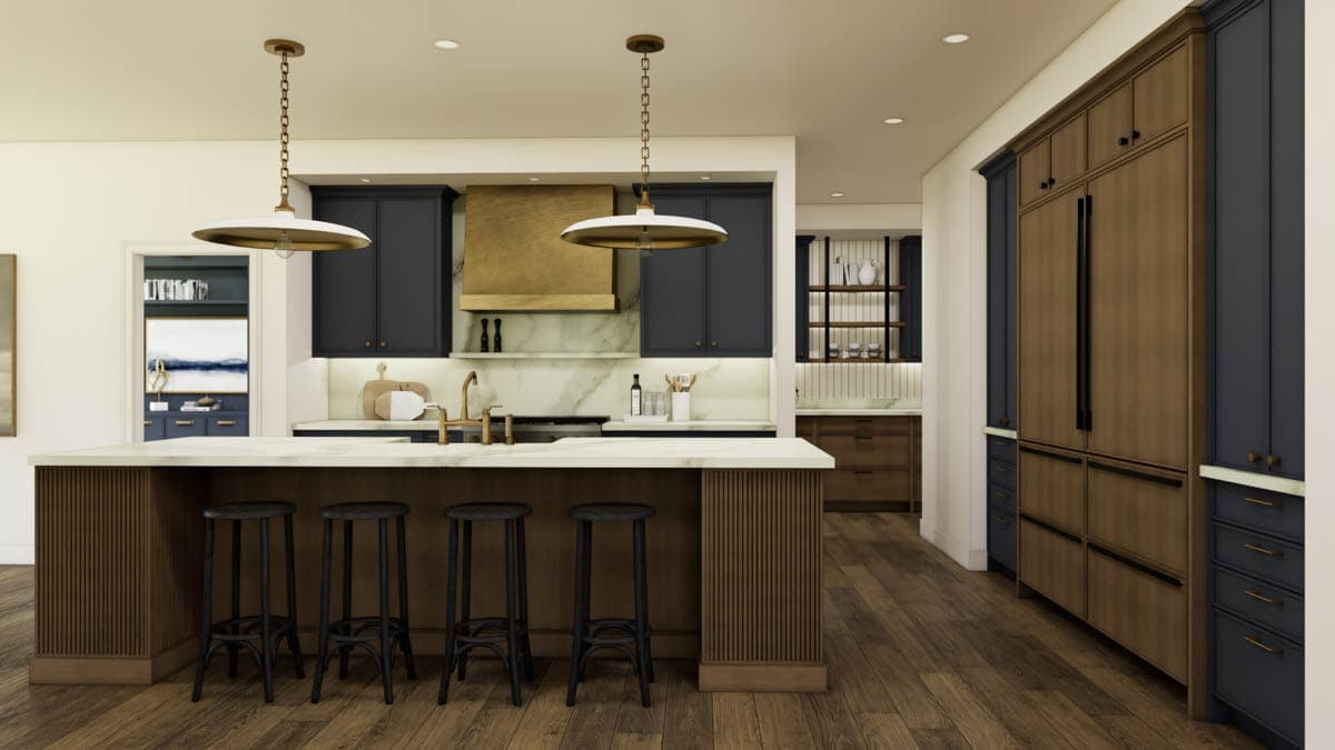 Modern kitchen with dark blue cabinets, a large island with seating, a brass range hood, and integrated refrigerator.
