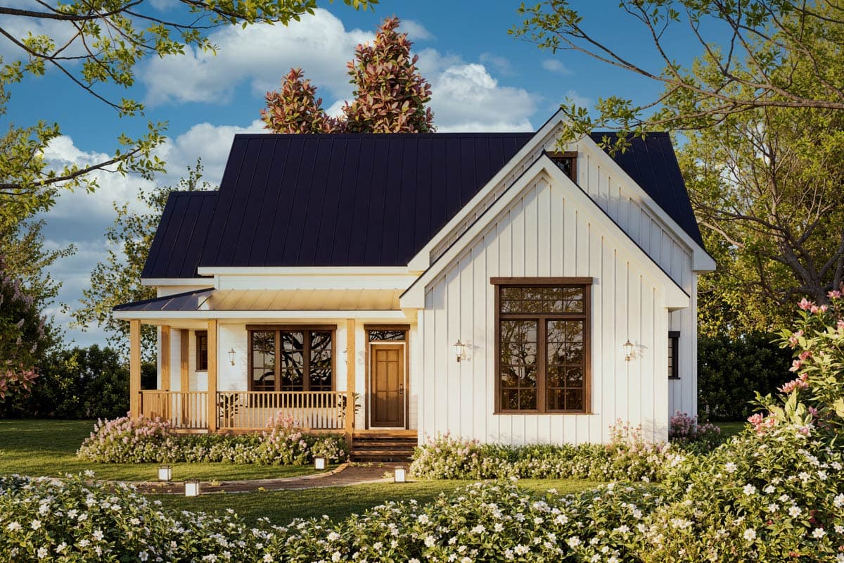 House plan exterior. Modern Farmhouse style, one-story. Features include a front porch with railing, a gable roof, and a dark metal roof.