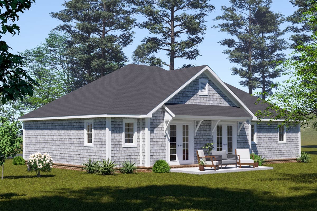 House plan exterior: Single-story home with cedar shingle siding, gabled dormer, and French doors leading to patio.