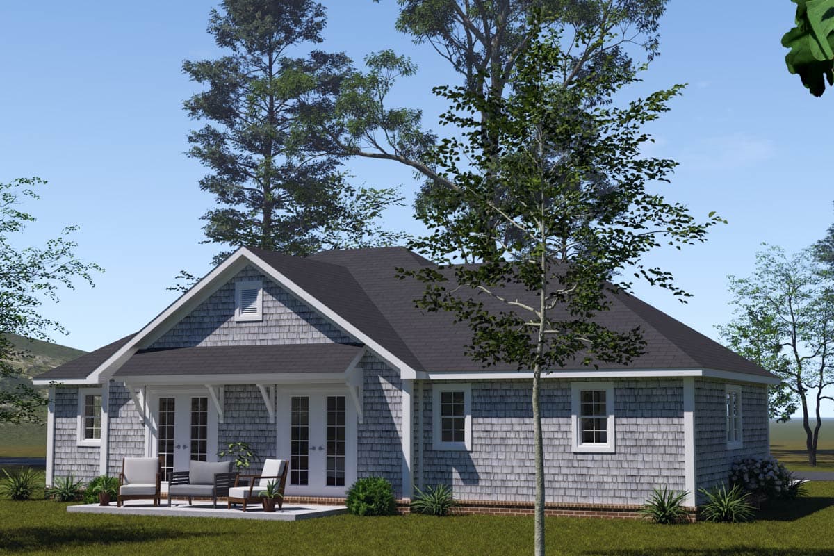 House plan exterior: Ranch style with shingle siding, dormer, covered porch with French doors, and multiple windows.