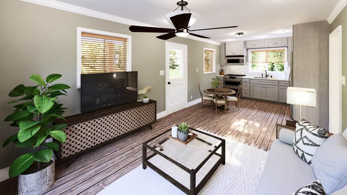 A modern, open-concept living space with a kitchen visible in the background. Features include a TV stand, coffee table, and hardwood floors.