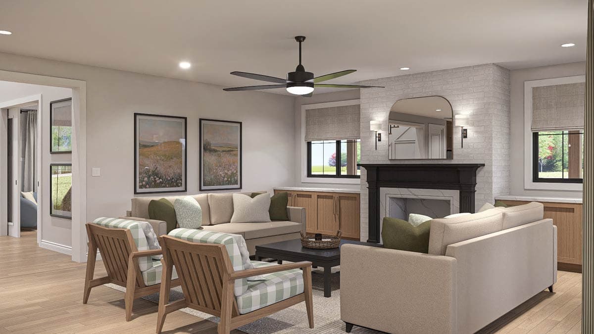 Living room with fireplace, built-in cabinetry, large windows, and comfortable seating arrangement.