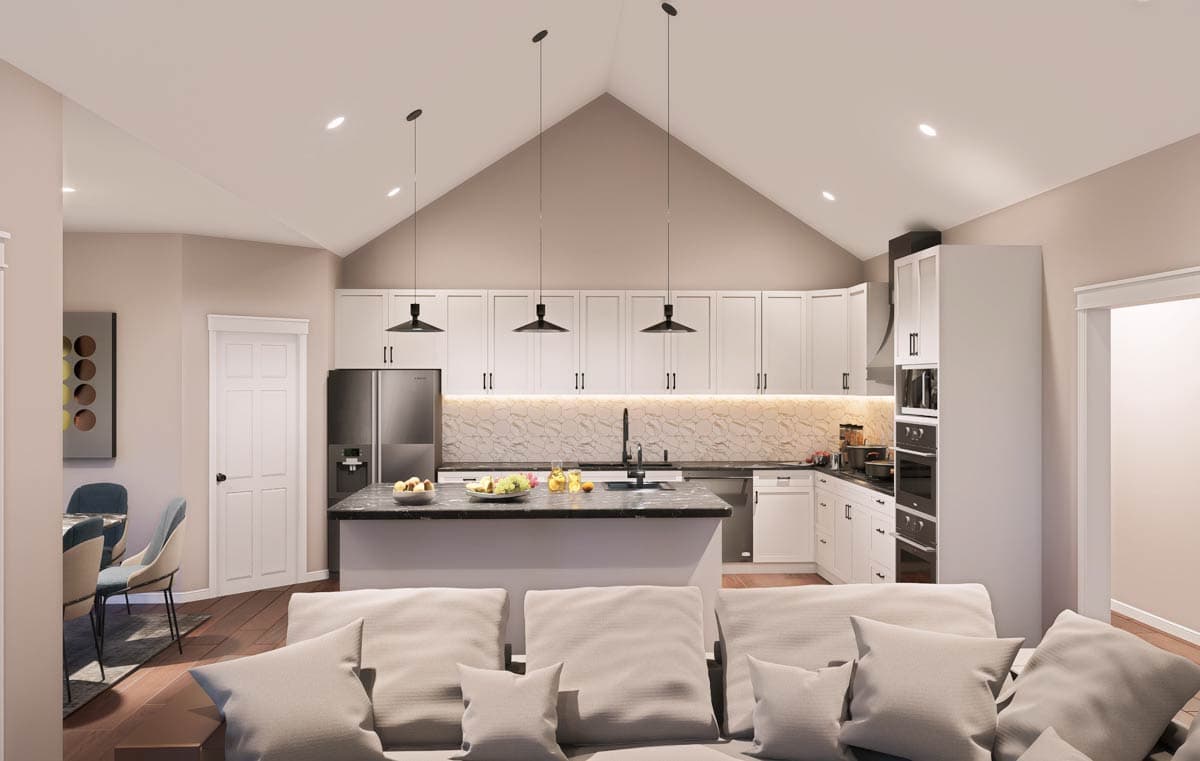 Modern kitchen with vaulted ceiling, island with seating, white cabinets, stainless steel appliances, and pendant lights.