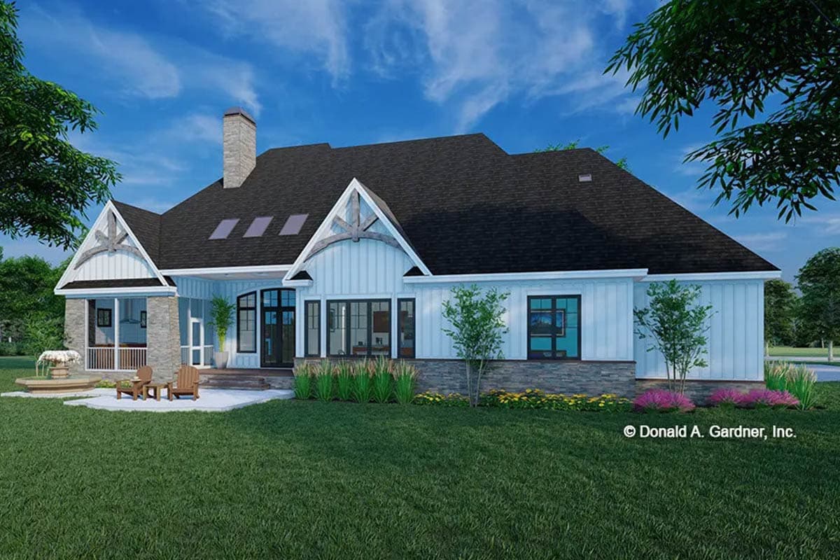 House plan exterior: Modern Farmhouse style, single story, gabled dormers, stone base, and large windows.