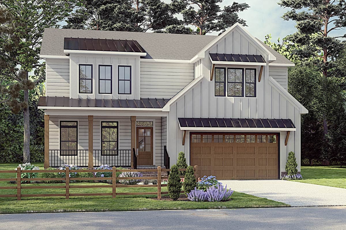 Two-story Modern Farmhouse exterior with a front porch, gables, and a detached garage with an overhanging roofline.