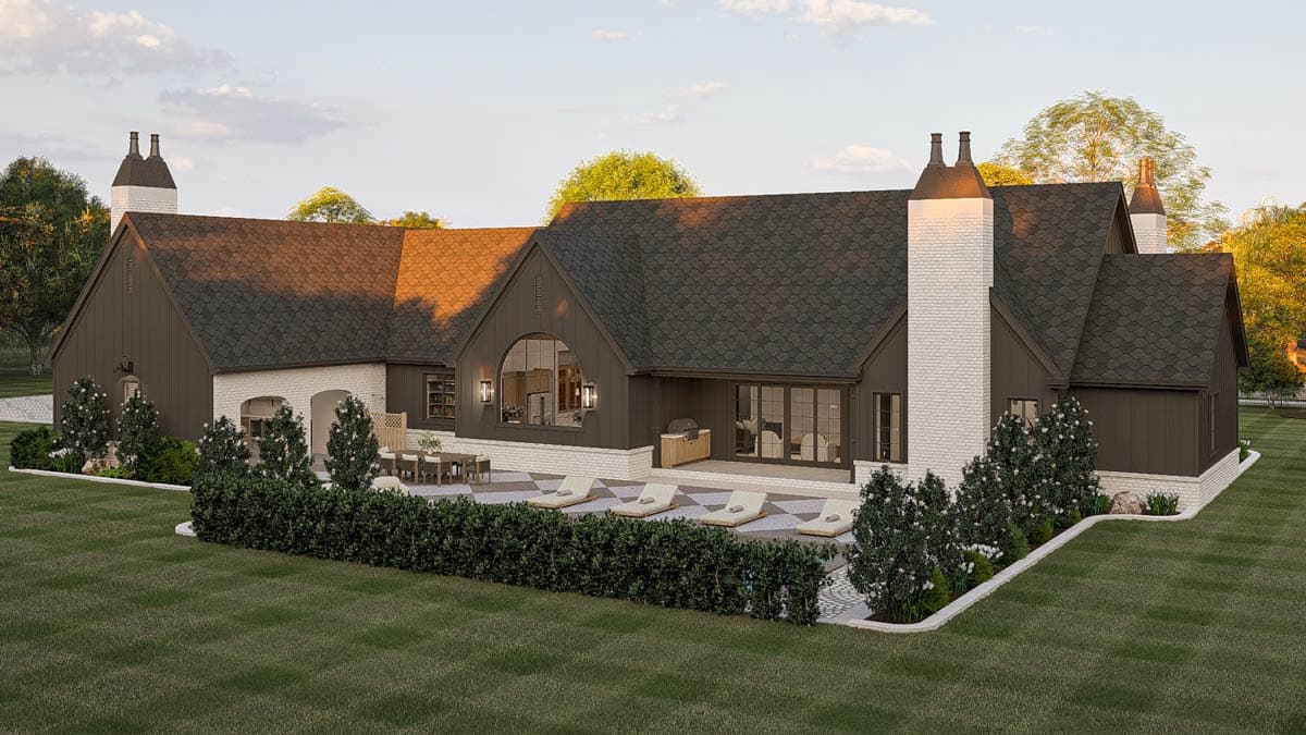 House plan exterior view: two-story, dark siding, white brick accents, gambrel rooflines, prominent chimneys with decorative tops.