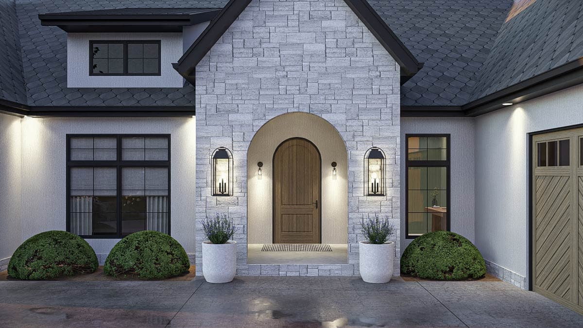 Modern Farmhouse house plan exterior with stone facade, arched wood door, dormer, and wood-paneled garage.