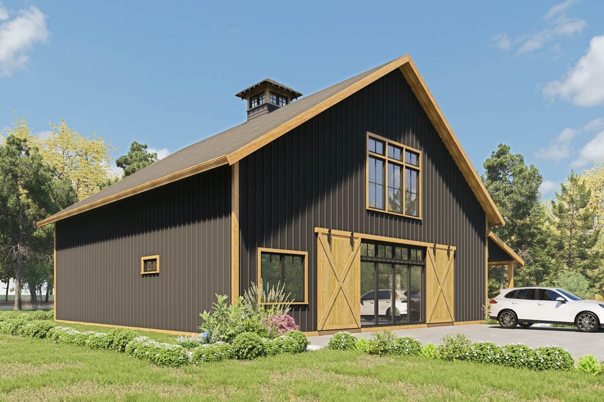 House plan exterior: Barn-style design with dark vertical siding, large barn doors, a prominent gable window, and cupola.