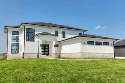 Modern House Plan with Main Level Master, Two-Story Great Room, 3-Car Garage