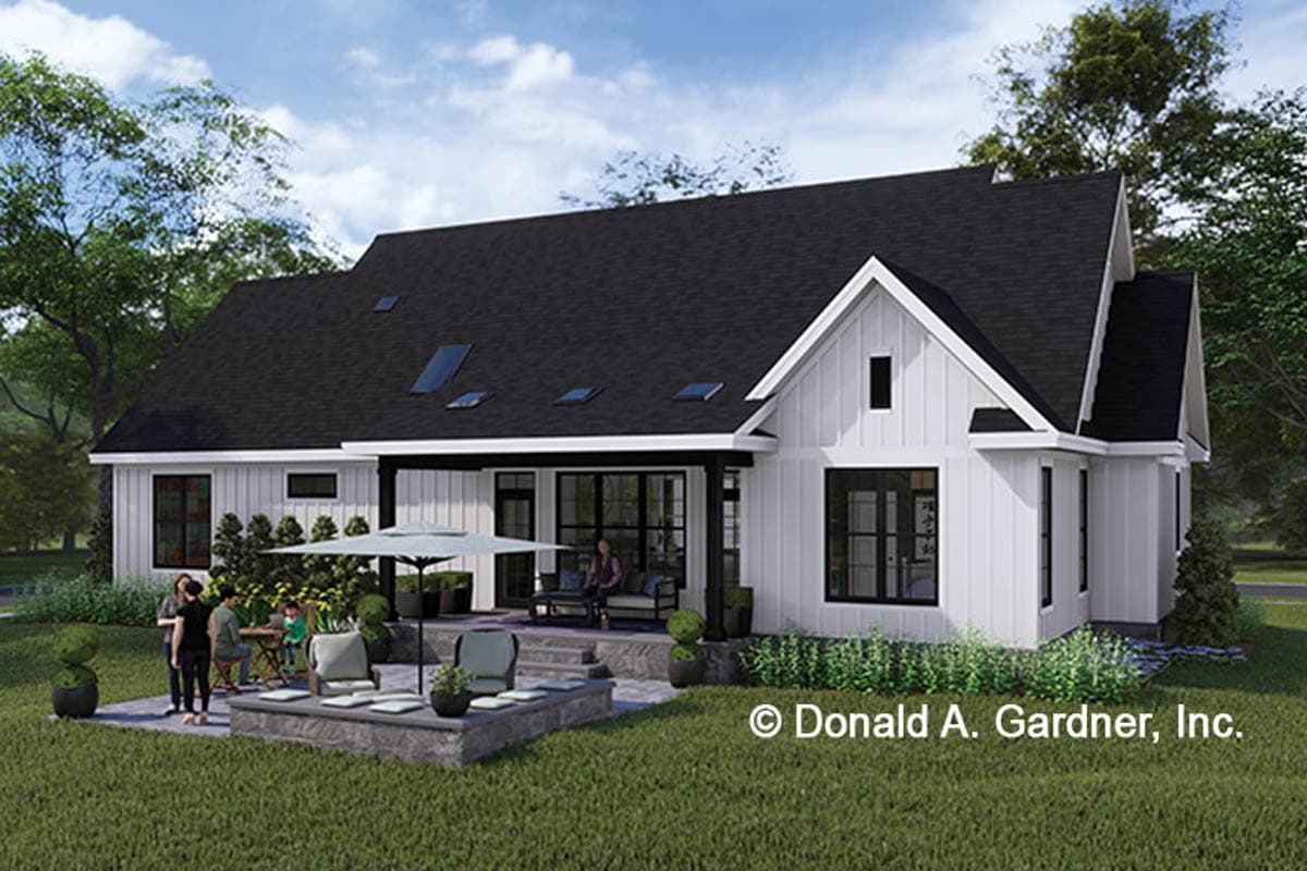 Modern Farmhouse style house plan exterior, one story, white board and batten siding, large gabled dormer, covered porch.