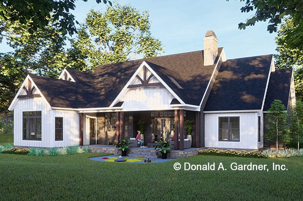 House plan exterior: Modern Farmhouse style, one story, with gabled roof, deep covered porch, and stone foundation.