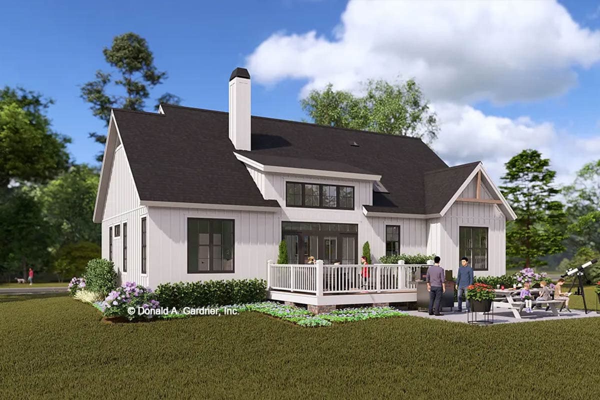 Modern Farmhouse house plan exterior with white board and batten siding, dark windows, prominent chimney, and wraparound deck.