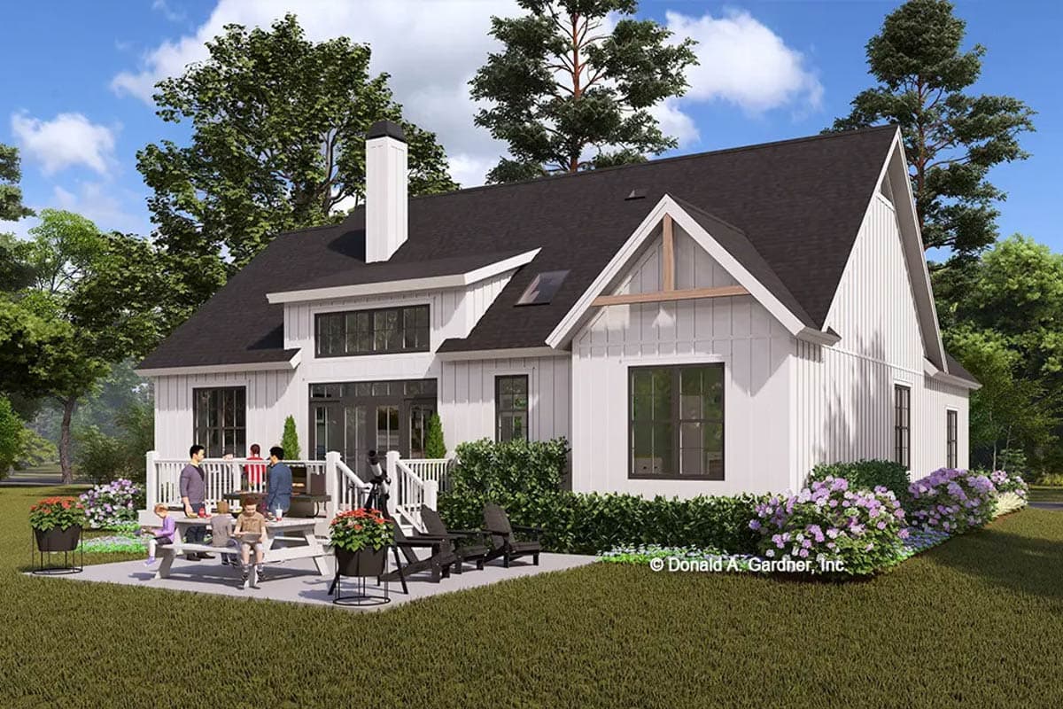Modern Farmhouse house plan exterior with white board and batten siding, prominent gables, and a large deck.