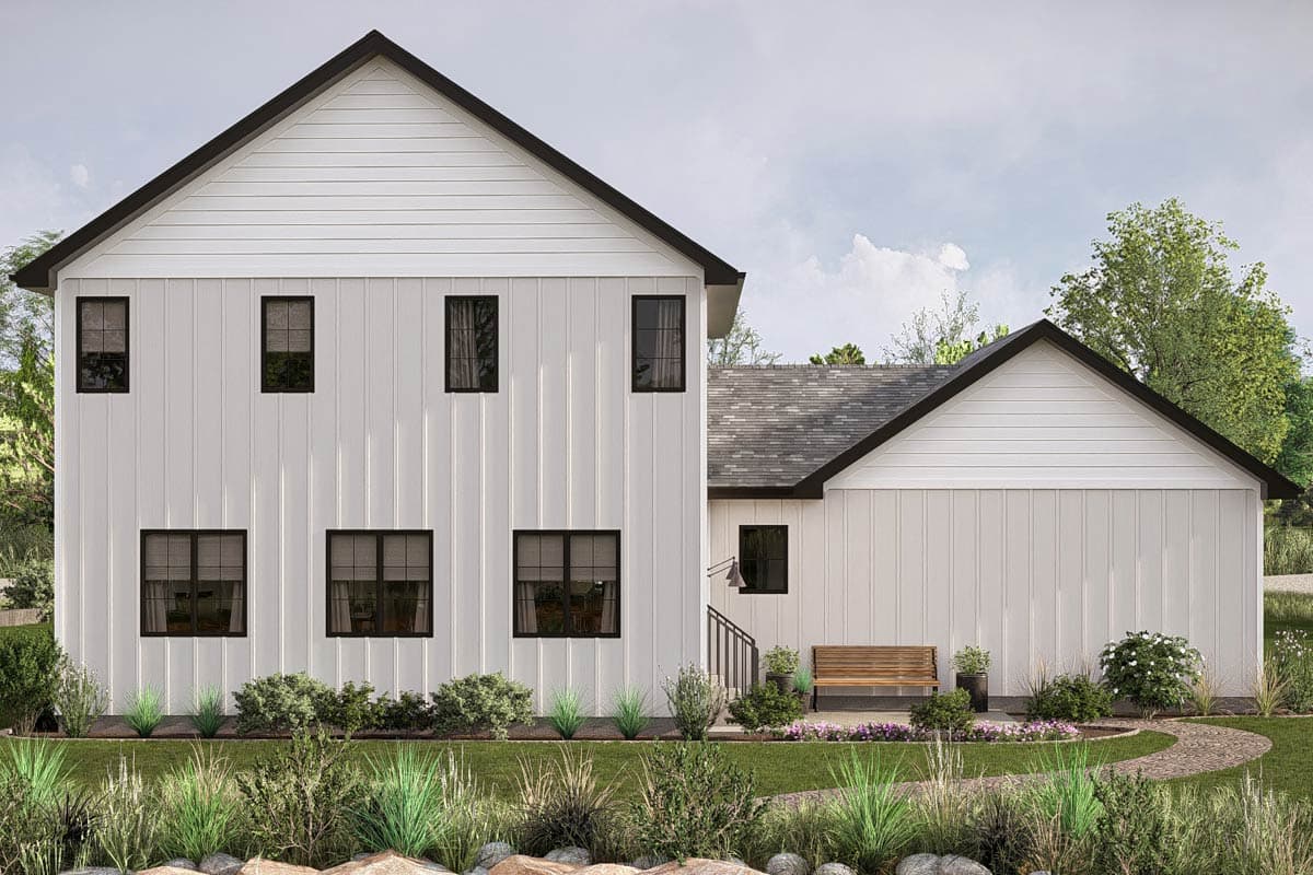 Modern Farmhouse style house plan exterior. Two stories, white board and batten siding, dark gables, and multiple windows.