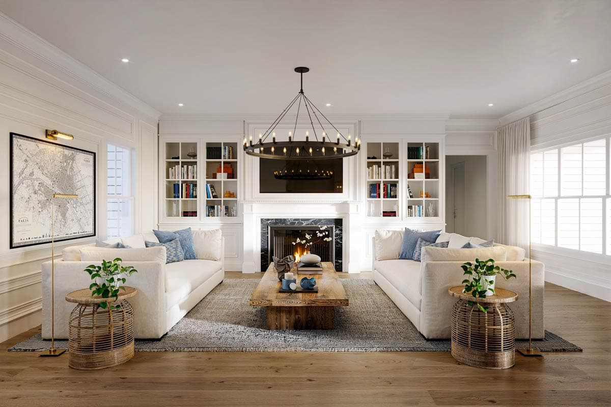 Living room with fireplace, built-in bookshelves, two sofas, and a large coffee table. Contemporary chandelier overhead.