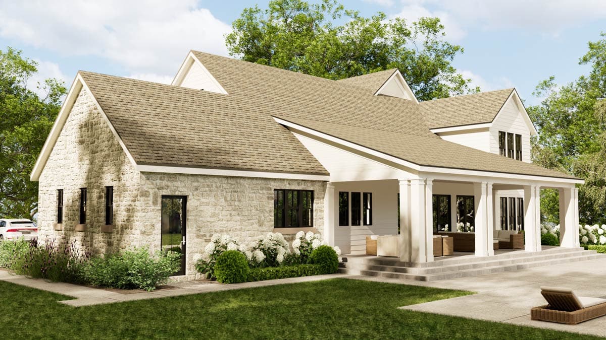 Exterior view of a modern house with stone facade, covered porch, and manicured landscaping.
