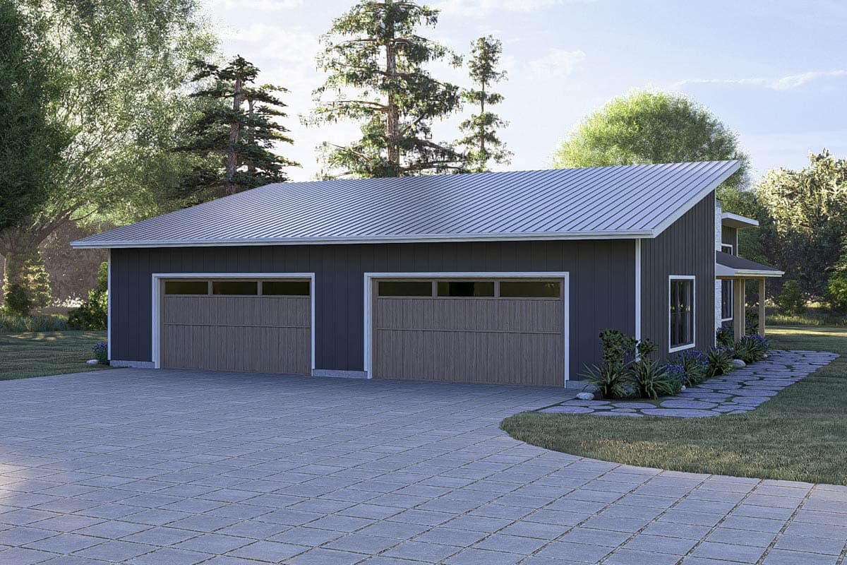 Modern two-story garage with metal roof, two wood-grain doors, and a small covered porch.