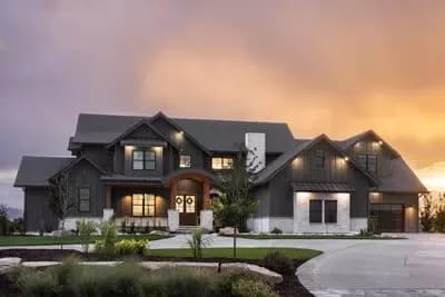 Luxurious 5-Bed Farmhouse House Plan with Two-Story Great Room and 4-Car Garage