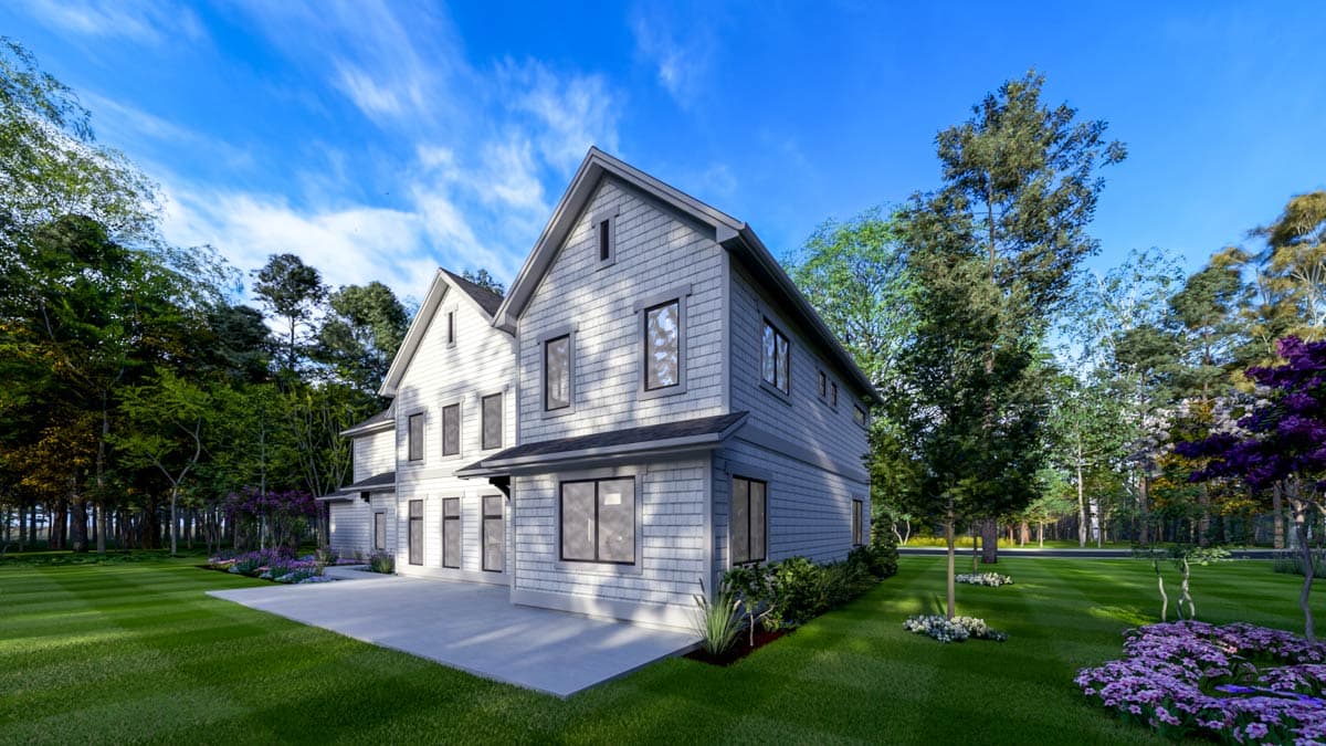 Exterior shot of a large, two-story gray house with green lawn and trees under a blue sky.