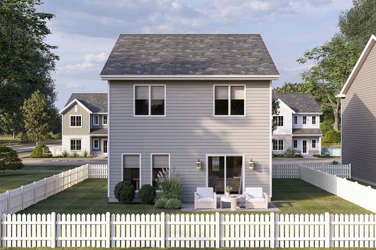 House plan exterior: two-story residence with horizontal siding, prominent gables, and a fenced backyard.