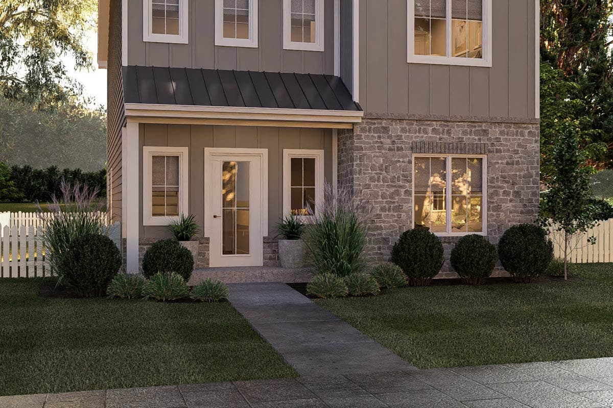 House plan exterior, two stories, board and batten siding, stone base, metal gable roof over entrance.