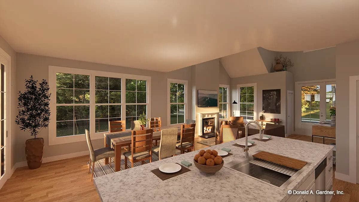 Open concept interior rendering showing a dining area, fireplace, and kitchen island with sink.