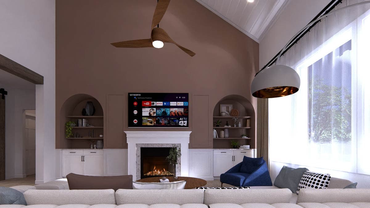 Great room with vaulted ceiling, fireplace, built-in shelving, and large window.