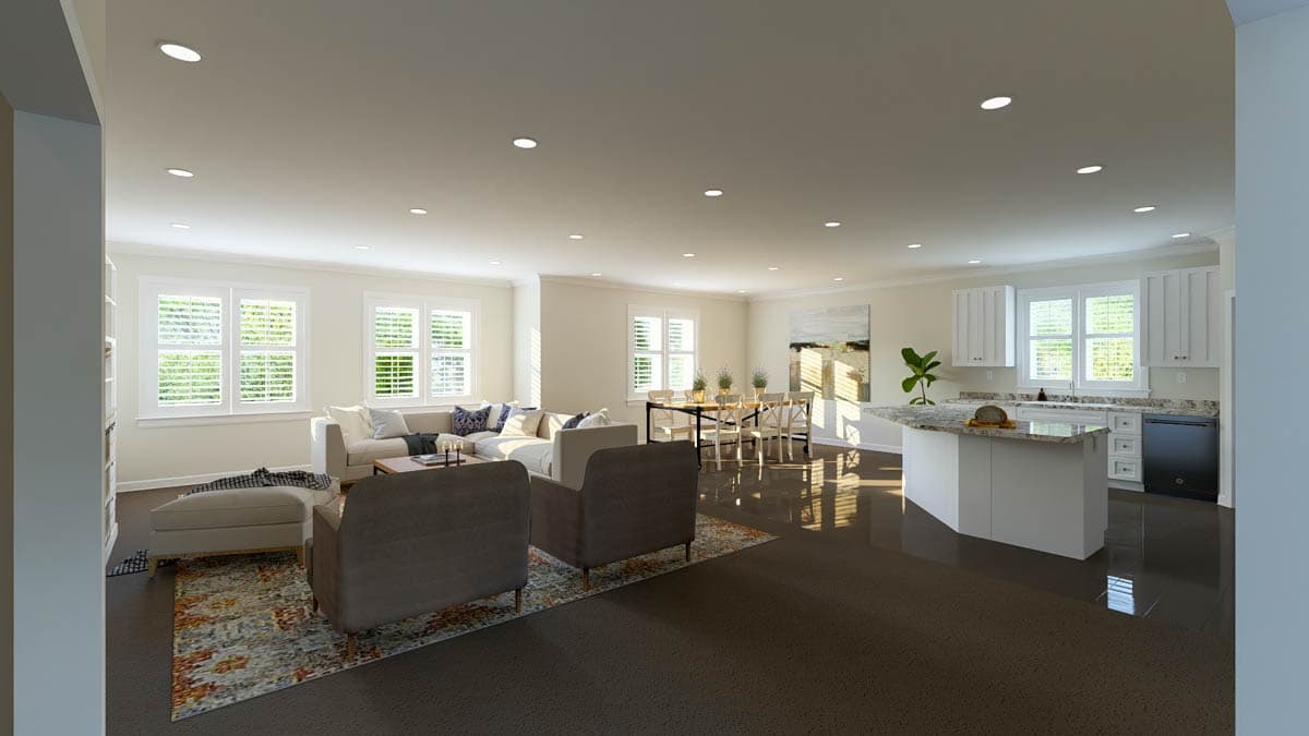 Open concept living area with kitchen island, dining area, and living room with sectional sofa and chairs.