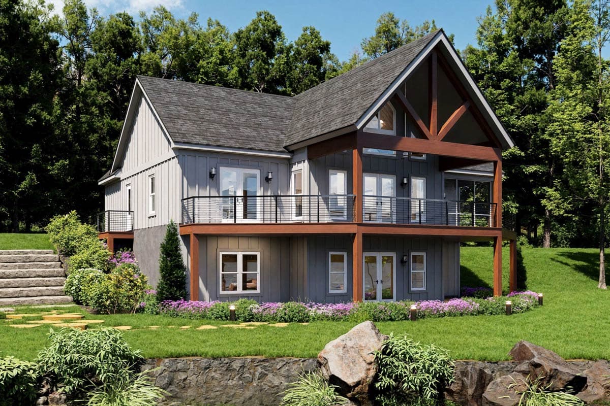 House plan exterior: Two-story Modern Farmhouse with gables, exposed wood beams, and a wraparound deck.